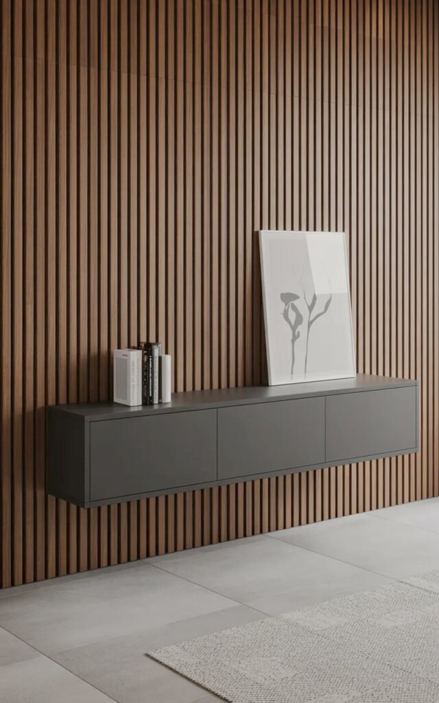 Wall-mounted console in dark finish integrated with vertical slat wall providing hallway storage