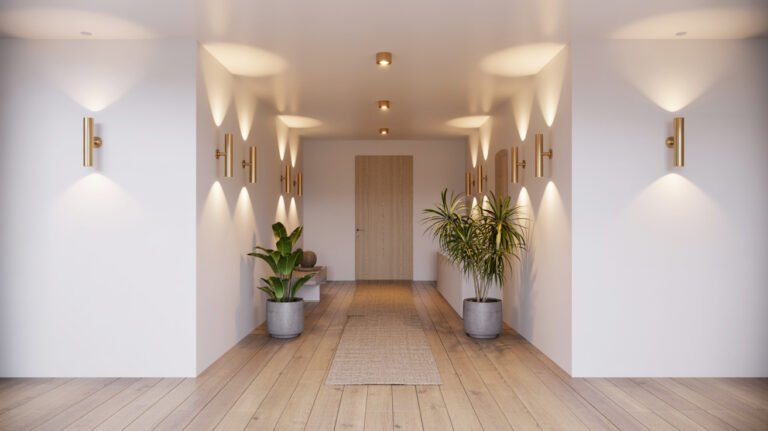 Contemporary hallway featuring brass cylindrical wall sconces, recessed lighting, plants and minimalist design