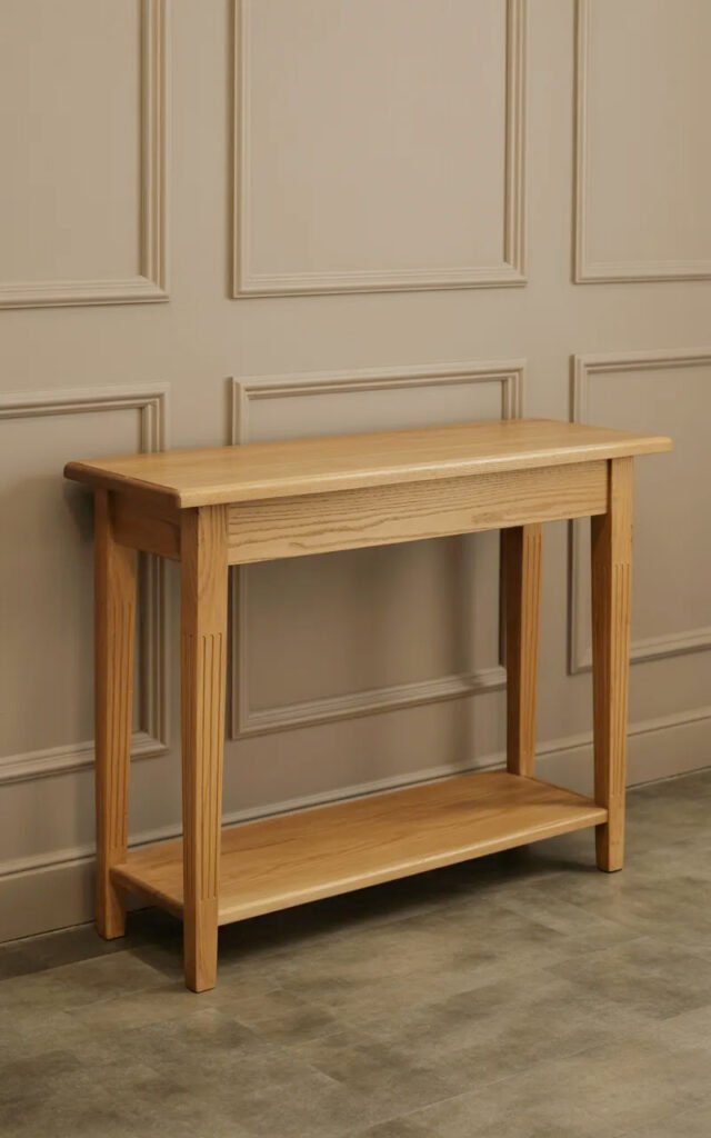 Simple oak console table with shelf providing functional storage in entrance hall