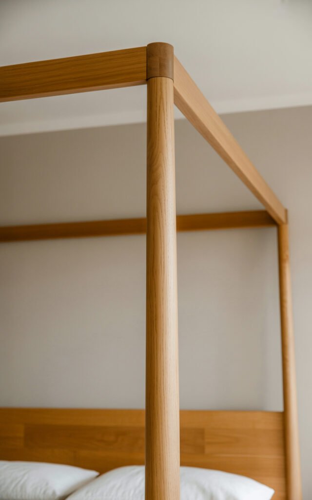 Light wood four-poster bed frame showing clean modern design perfect for bohemian bedroom