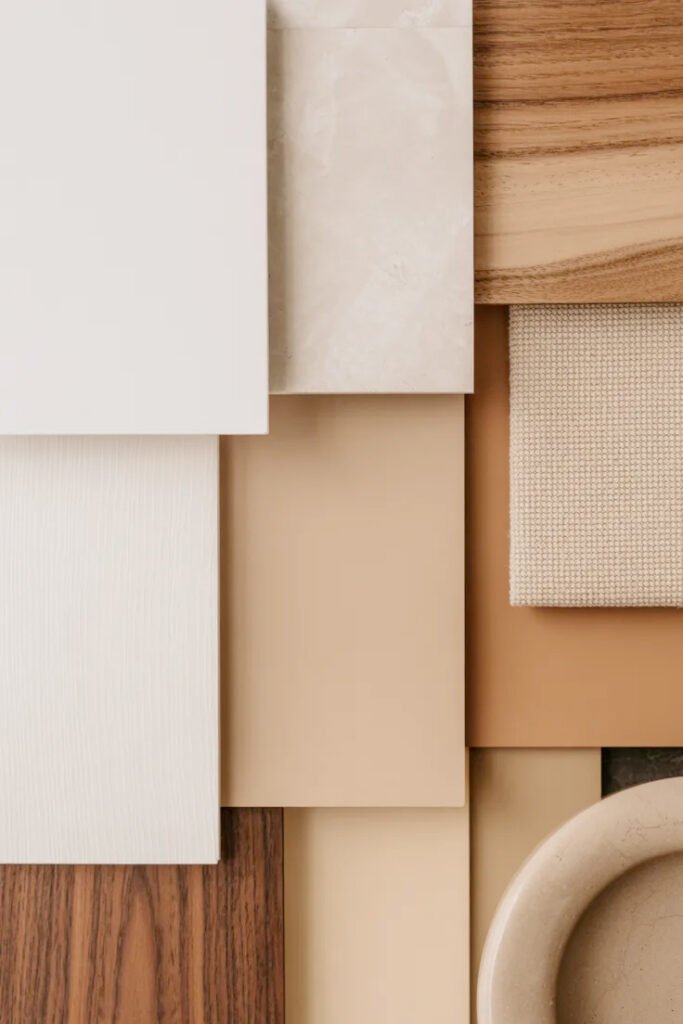 Warm neutral color scheme featuring whites, creams and browns for cohesive console decor