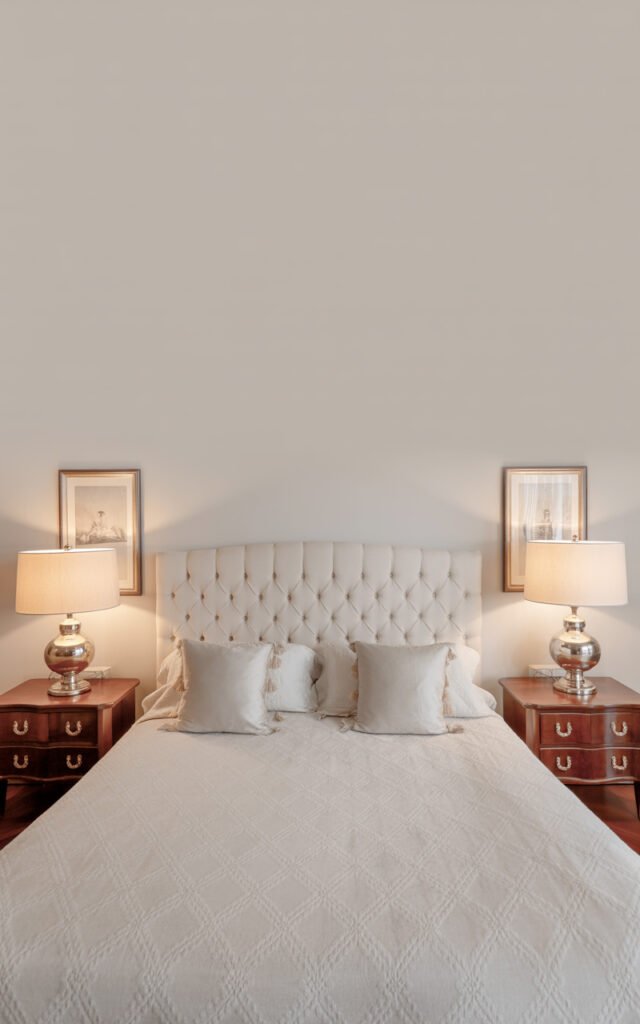 Symmetrical bedroom with centered bed and matching nightstands creating balanced elegant design
