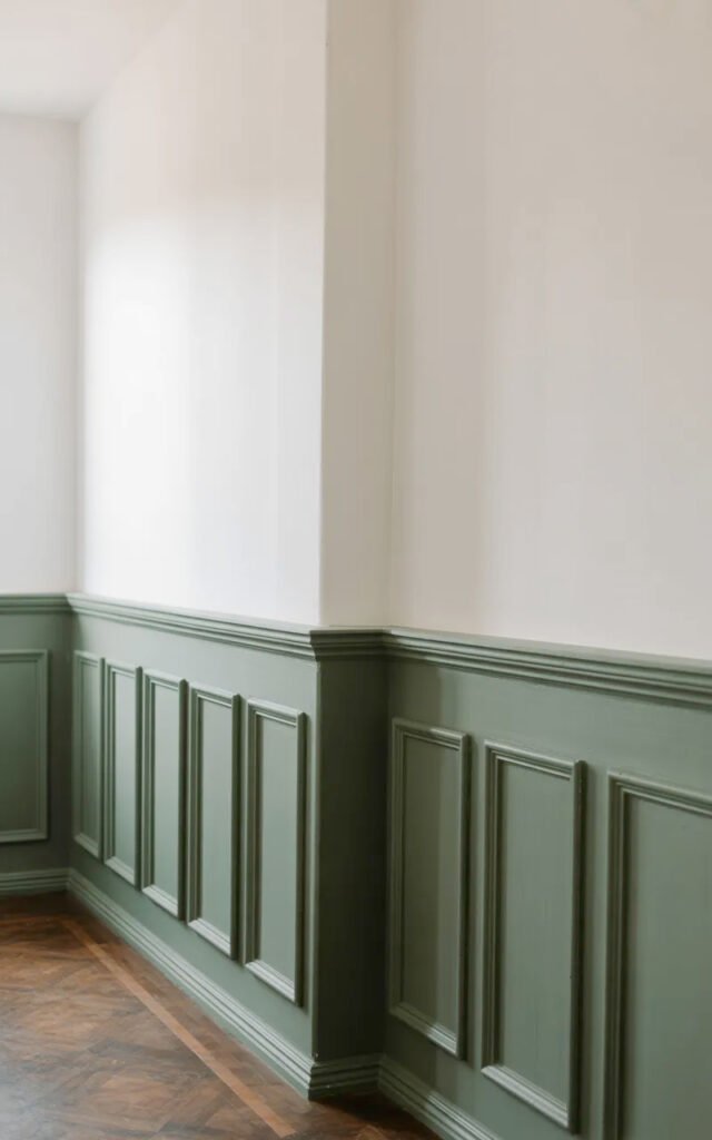 Traditional two-tone wall treatment with colored wainscoting and neutral upper wall