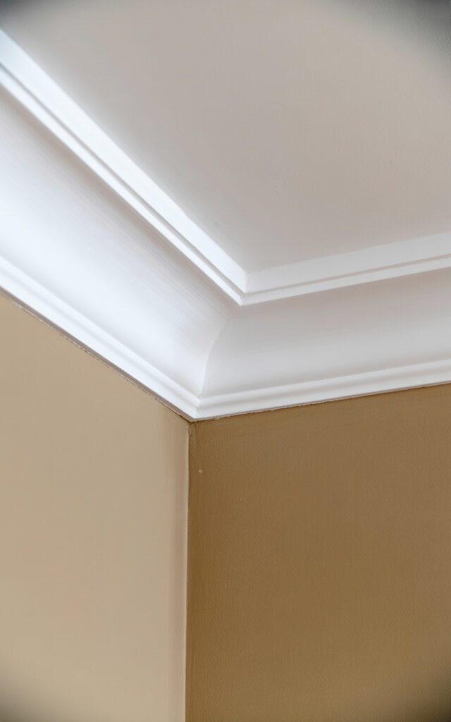 Traditional white crown molding adding architectural finish to narrow hallway design