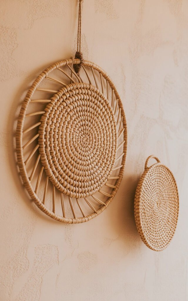 Natural fiber woven wall hangings creating textural focal point in earthy bedroom